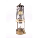 A PATTERSON G.P.O. BRASS AND STEEL MINER'S LAMP