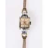 A VINTAGE MOVADO LADY'S WRIST WATCH WITH 9 CARAT GOLD STRAP