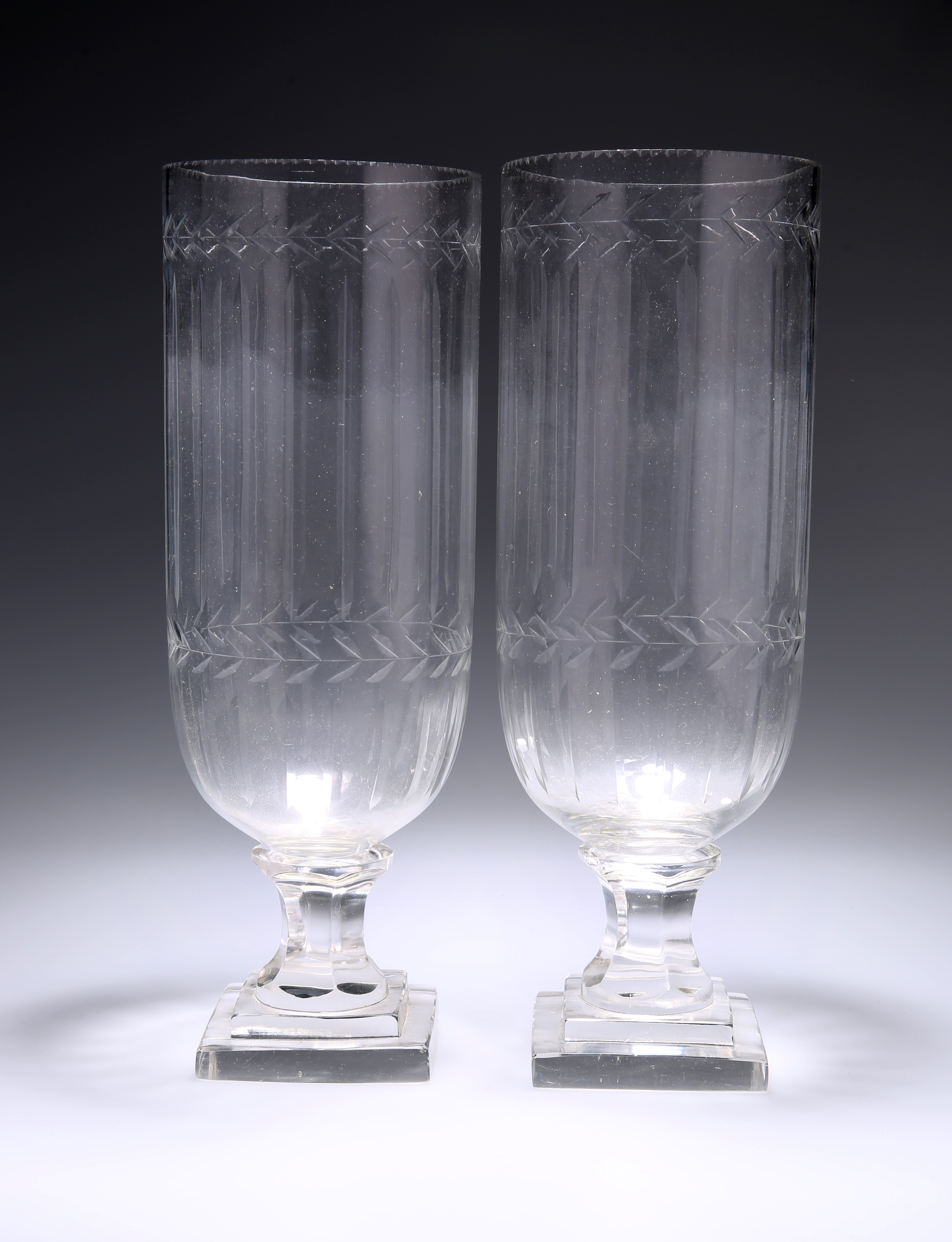 A PAIR OF CUT-GLASS VASES