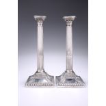A PAIR OF EARLY GEORGE III SILVER COLUMNAR CANDLESTICKS