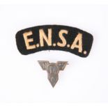 AN ENSA (ENTERTAINMENTS NATIONAL SERVICE ASSOCIATION) SHOULDER TITLE AND BADGE. (2)