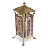 AN ART NOUVEAU BRASS AND COLOURED GLASS FLOOR LANTERN