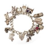 A CHARM BRACELET, charms include London bus