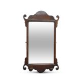 A GEORGE III MAHOGANY FRETWORK MIRROR, with bevelled mirror-plate