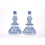 A PAIR OF CHINESE MING STYLE BLUE AND WHITE CANDLESTICKS