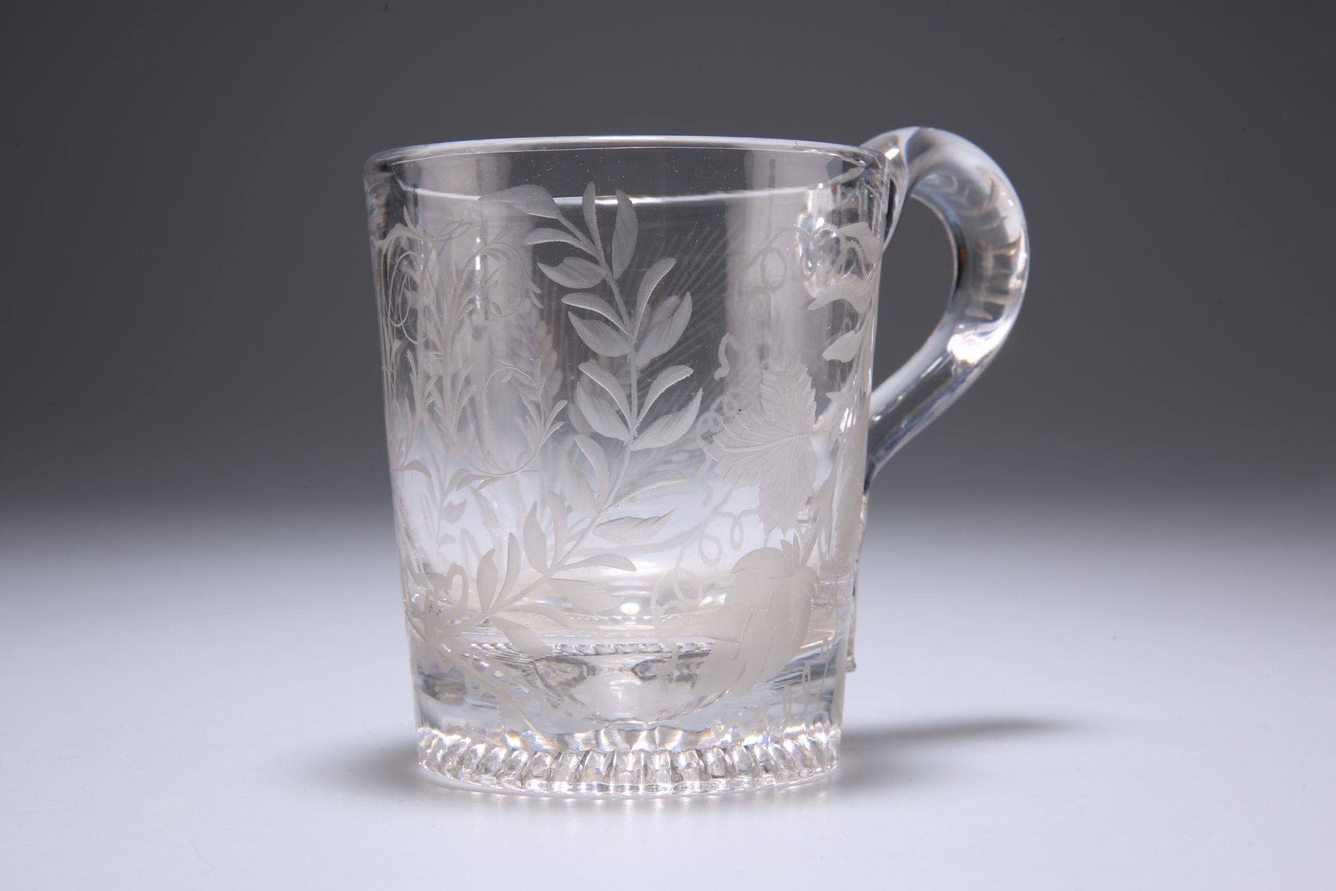 A 19TH CENTURY ENGRAVED GLASS MUG