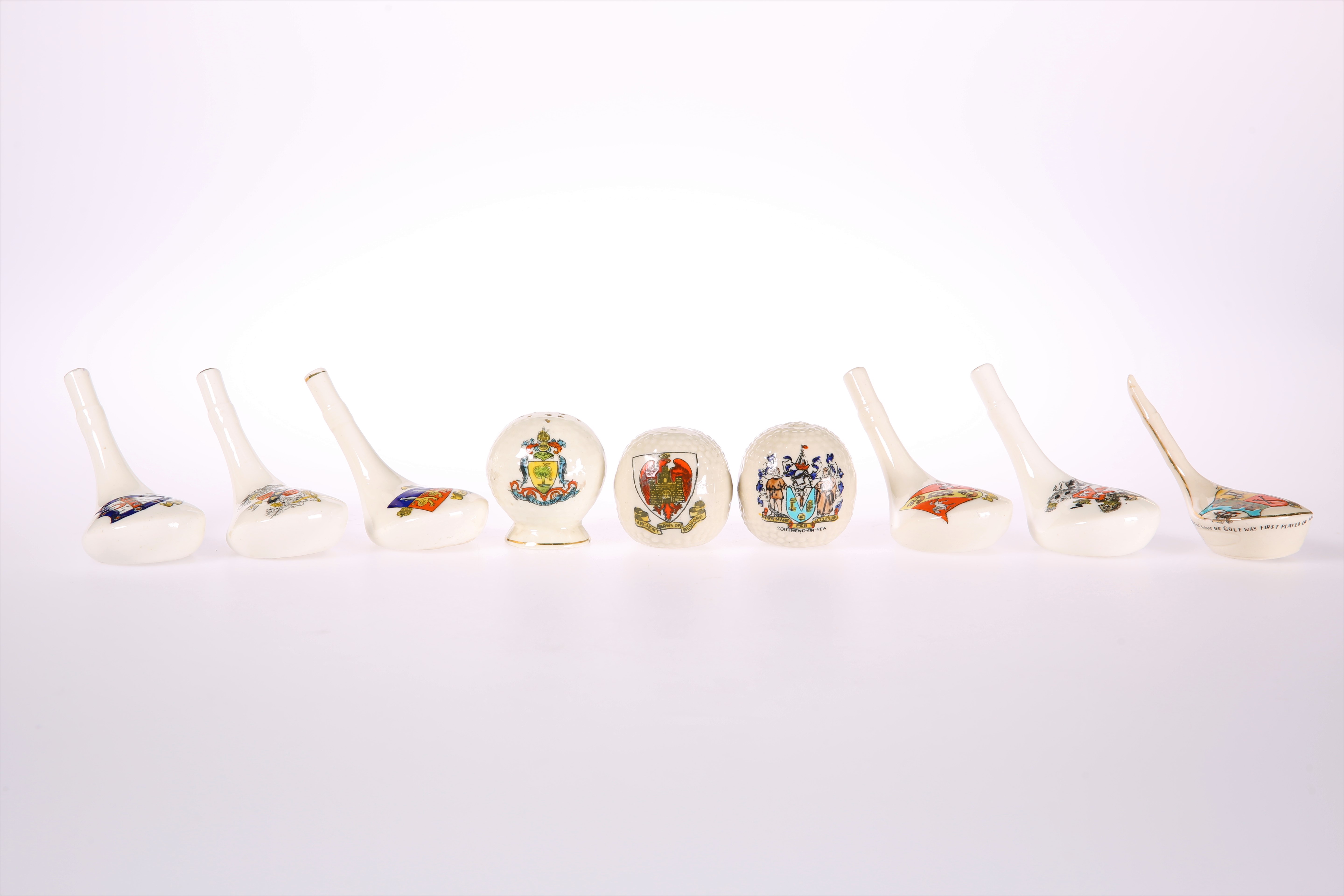 NINE ITEMS OF CRESTED CHINA OF GOLFING INTEREST