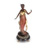 A PAINTED AND GILDED BRONZE FIGURE OF A LADY