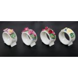 A SET OF FOUR ROYAL DOULTON NAPKIN RINGS, CIRCA 1920'S