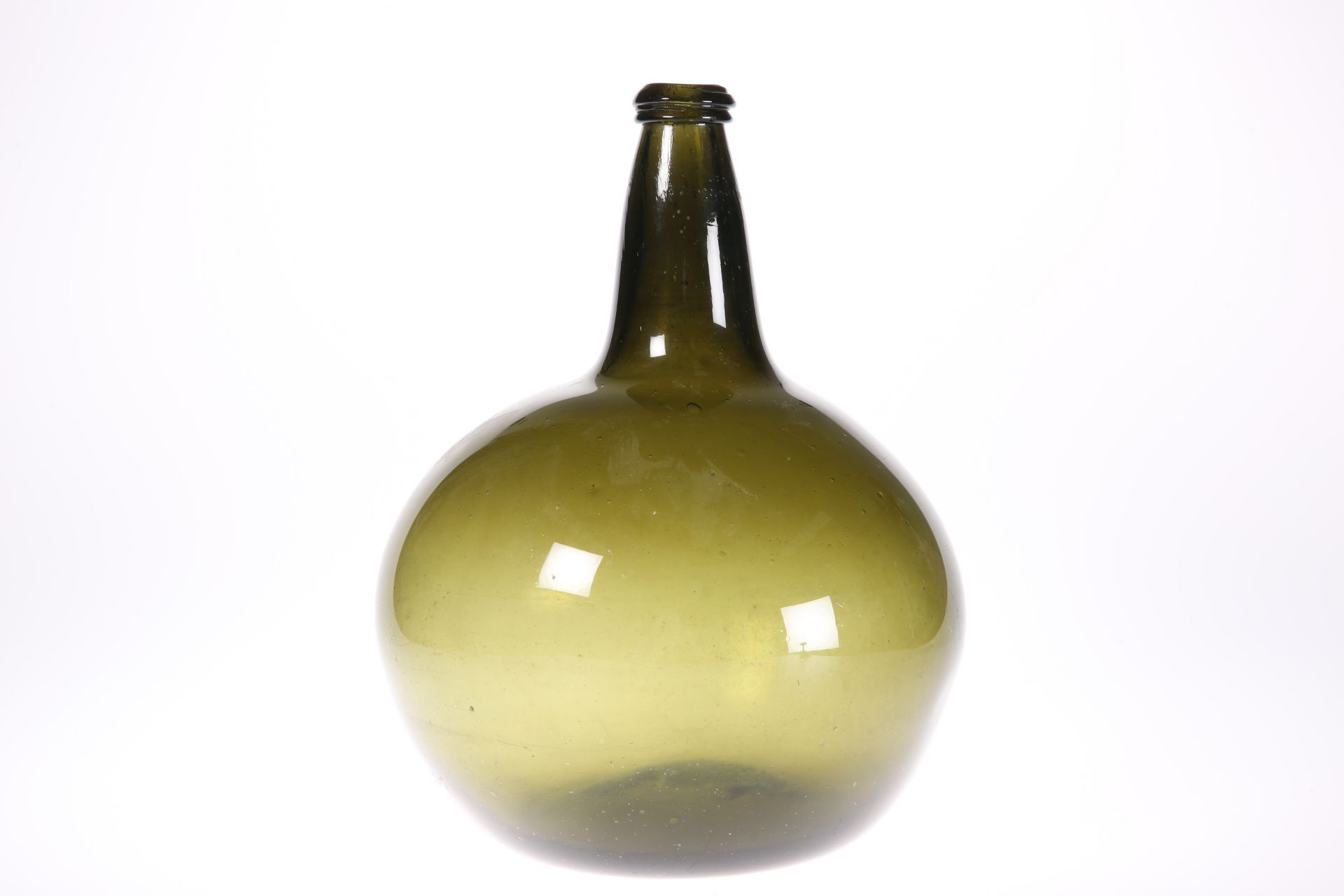 A LARGE GREEN GLASS ONION BOTTLE