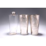 AN INDIAN COLONIAL GLASS SPIRIT FLASK AND TWO SILVER BEAKERS