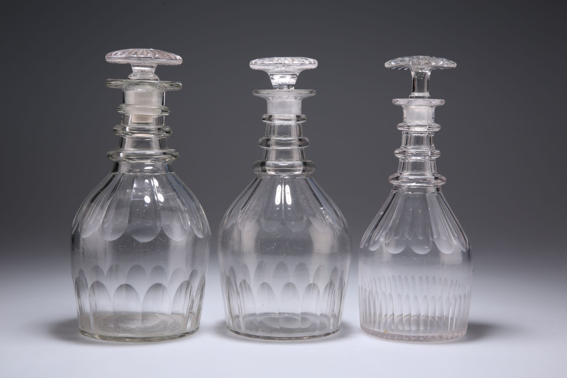 THREE 19TH CENTURY TRIPLE RING NECK GLASS DECANTERS