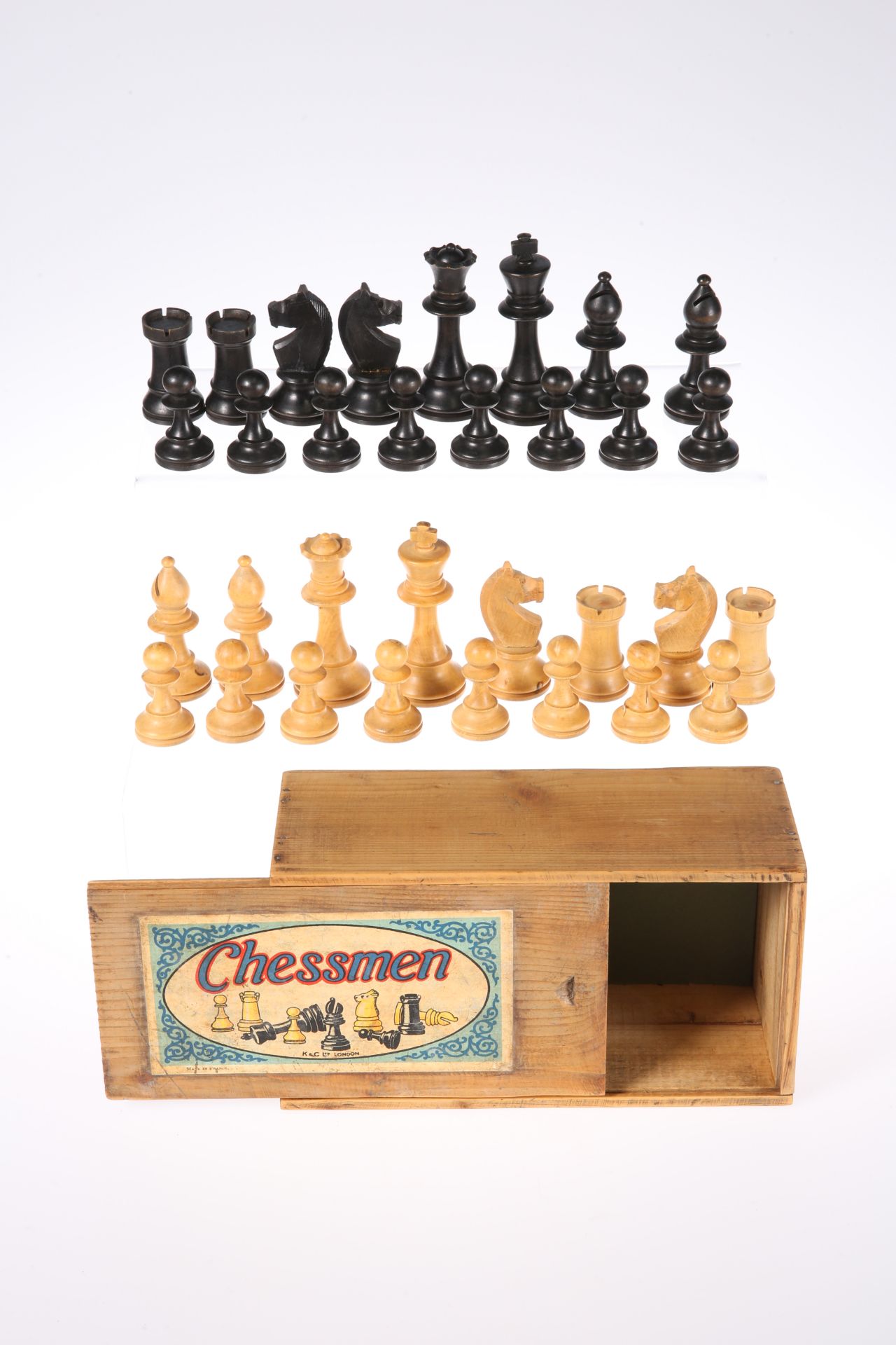 A VINTAGE FRENCH WOODEN "CHESSMEN" CHESS SET