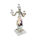 A CONTINENTAL PORCELAIN FIGURAL CANDELABRUM, CIRCA 1900