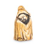 A CHINESE MAMMOTH IVORY CARVING OF A SLEEPING SCHOLAR