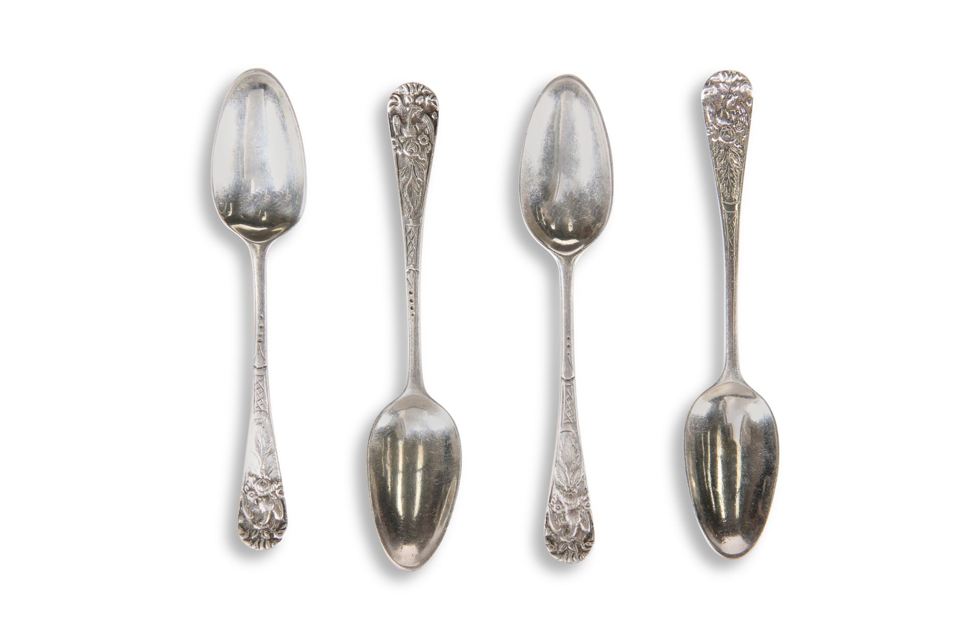 A SET OF FOUR 18TH CENTURY SILVER PICTURE-BACK TEA SPOONS