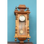 A 19TH CENTURY WALNUT VIENNA PATTERN WALL CLOCK