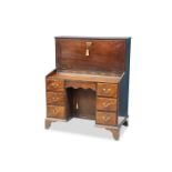 A GEORGE III MAHOGANY FALL-FRONT DESK