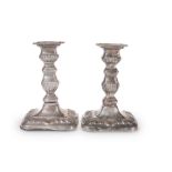 A PAIR OF EDWARDIAN SILVER CANDLESTICKS