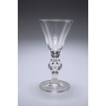 A LARGE VICTORIAN GLASS RUMMER IN THE FORM OF A GEORGIAN HEAVY BALUSTER GLASS