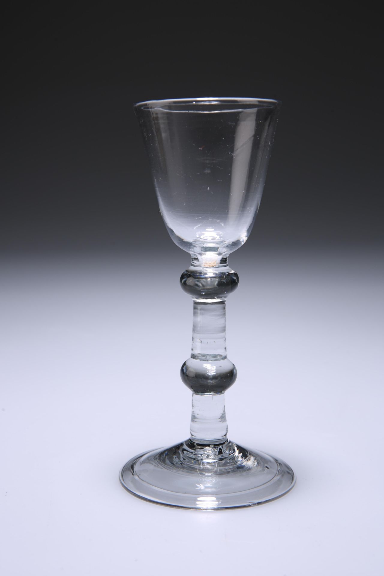 A BALUSTROID WINE GLASS