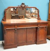 A VICTORIAN MAHOGANY FOUR-DOOR MIRROR-BACK CHIFFONIER, the mirror superstructure with leaf-carved