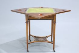 A LATE VICTORIAN INLAID ROSEWOOD ENVELOPE GAMES TABLE