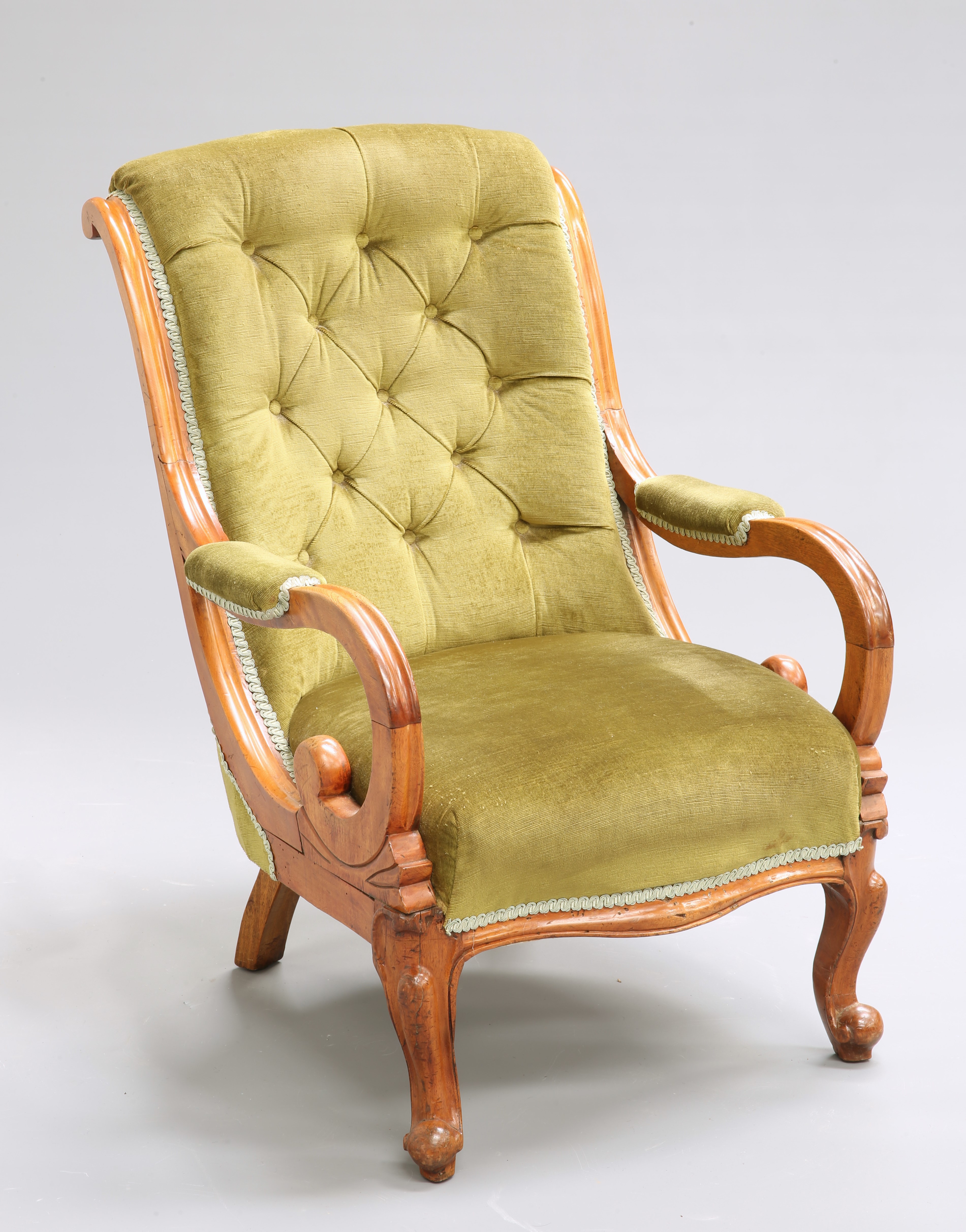 A VICTORIAN MAHOGANY AND UPHOLSTERED ARMCHAIR
