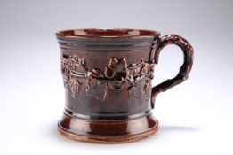 A VICTORIAN TREACLE GLAZE TANKARD