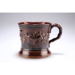 A VICTORIAN TREACLE GLAZE TANKARD