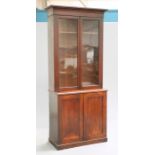 A 19TH CENTURY MAHOGANY BOOKCASE CABINET