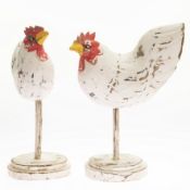 A PAIR OF CARVED AND PAINTED WOODEN BUTCHER'S ADVERTISING HENS