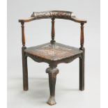 A VICTORIAN OAK CORNER CHAIR