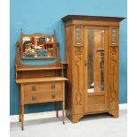 AN ART NOUVEAU OAK TWO-PIECE BEDROOM SUITE