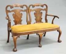 A WALNUT CHAIR BACK SETTEE, IN GEORGE II STYLE, 19TH CENTURY