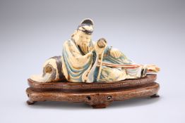 A CHINESE PAINTED AND STAINED IVORY FIGURE, 19TH CENTURY