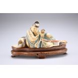 A CHINESE PAINTED AND STAINED IVORY FIGURE, 19TH CENTURY