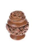 A CHINESE CARVED WOODEN TOBACCO JAR