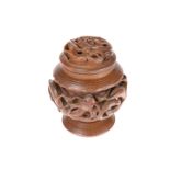 A CHINESE CARVED WOODEN TOBACCO JAR