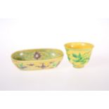 A CHINESE YELLOW GROUND BEAKER CUP
