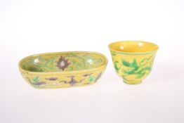 A CHINESE YELLOW GROUND BEAKER CUP