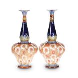 A LARGE PAIR OF DOULTON LAMBETH STONEWARE VASES