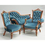A VICTORIAN WALNUT THREE-PIECE DRAWING ROOM SUITE, comprising chaise longue, armchair and side