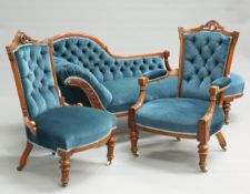 A VICTORIAN WALNUT THREE-PIECE DRAWING ROOM SUITE, comprising chaise longue, armchair and side