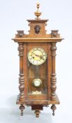 A SMALL 19TH CENTURY WALNUT VIENNA PATTERN WALL CLOCK