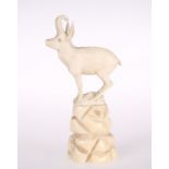 A CONTINENTAL 19TH CENTURY IVORY CARVING OF AN IBEX