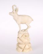 A CONTINENTAL 19TH CENTURY IVORY CARVING OF AN IBEX