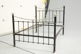 AN EDWARDIAN SILVERED METAL AND CAST IRON BED