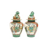A PAIR OF CHINESE PORCELAIN VASES AND COVERS