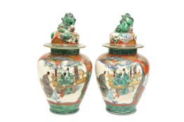 A PAIR OF CHINESE PORCELAIN VASES AND COVERS